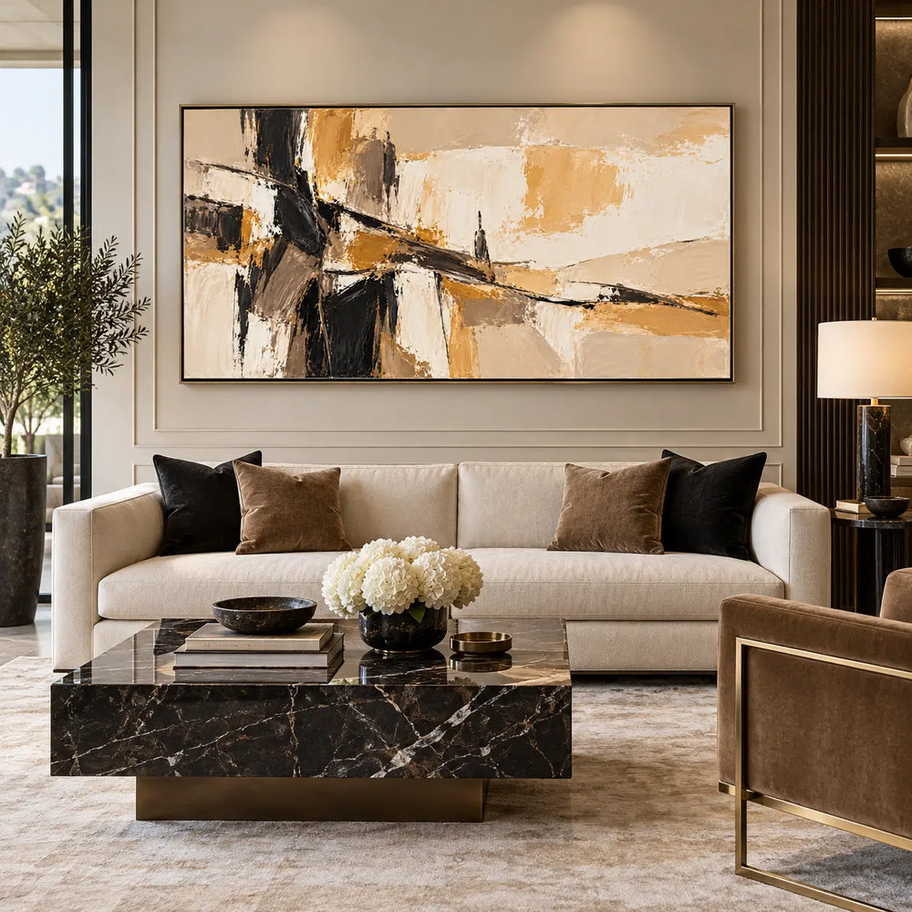 A Dark Seam Through Sand: above a cream sofa against a paneled wall with white flowers and black cushions
