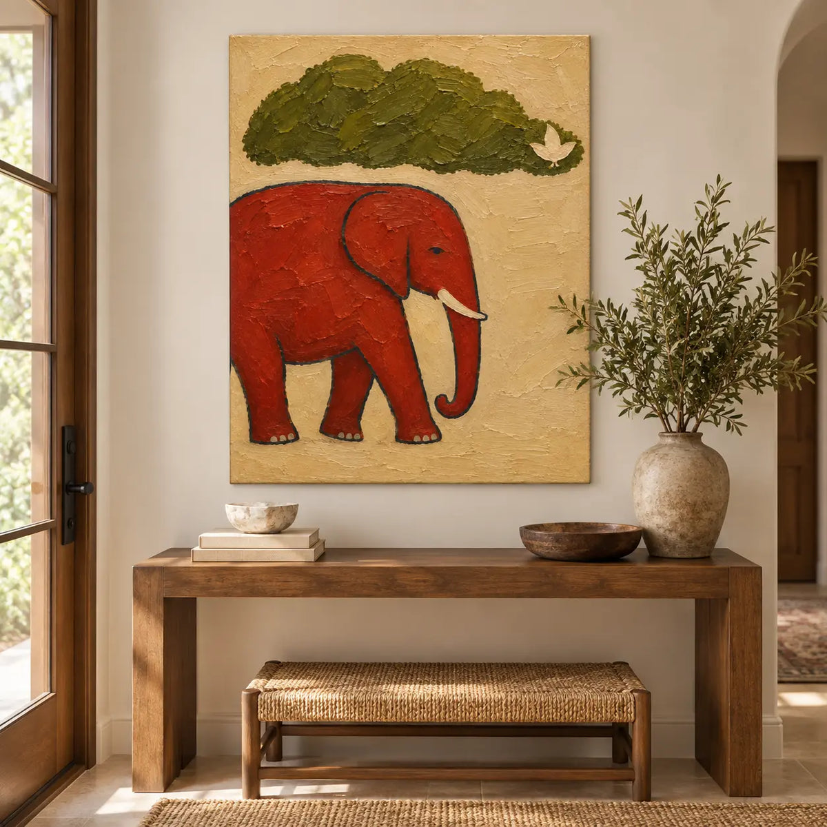 A Small Bird for an Elephant: above a wood console and woven bench beside a glass paneled door