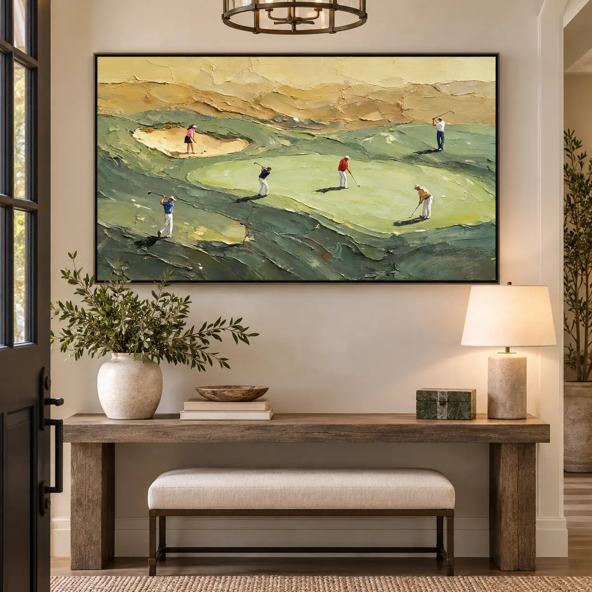 An Afternoon on the Links above an entry console beside a ceramic lamp and upholstered bench