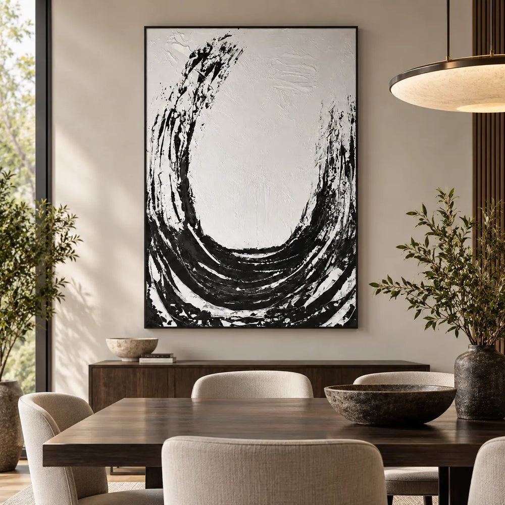 An Arc Left Open: behind a wood dining table with cream chairs beneath a wide circular pendant