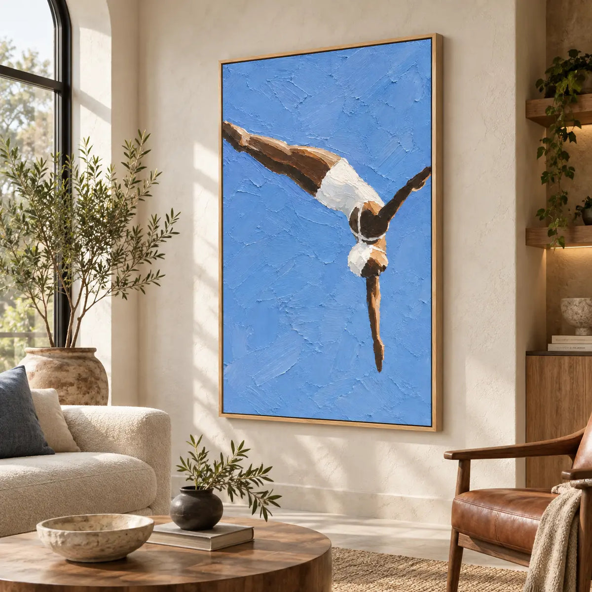 Arc into Blue above a neutral sectional beside a leather chair and round wood table