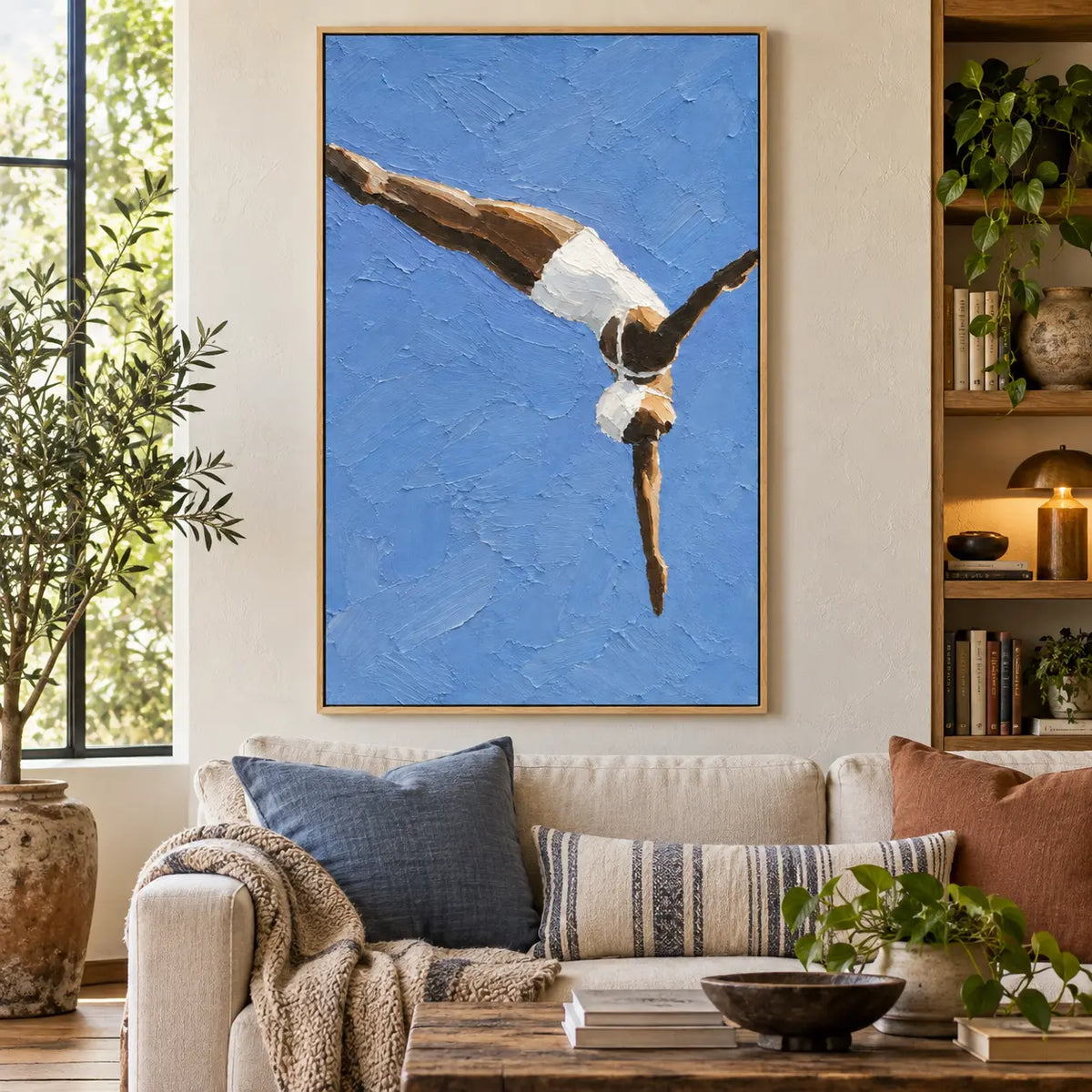 Arc into Blue above a sofa with blue cushions beside a tall window