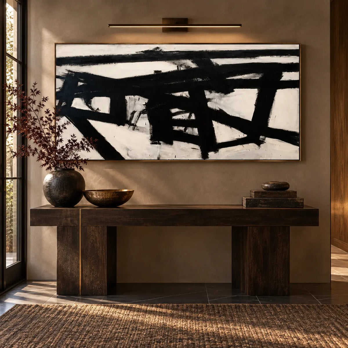Crossing the Ivory Field: above a dark console beneath a slim brass picture light