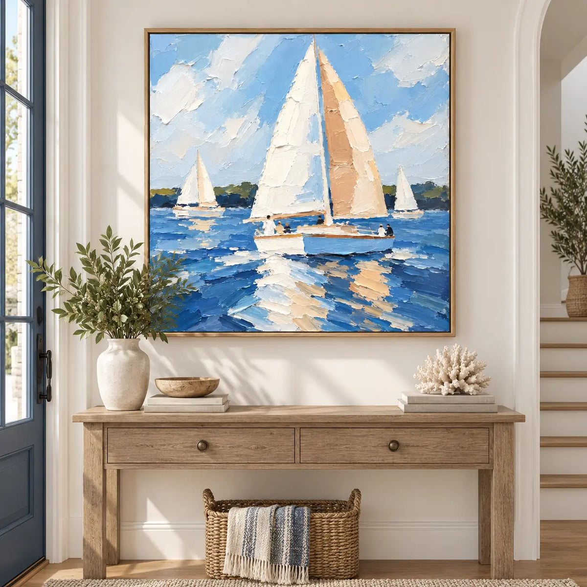 Full Sail in June above a light wood entry console with baskets and a striped throw