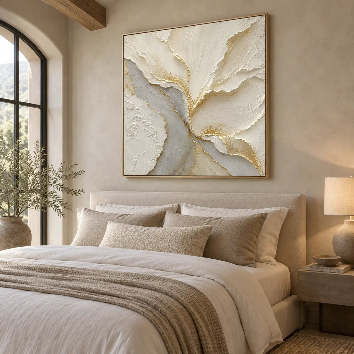 Gilded Faultlines: above a linen bed beside an arched window and ceramic lamp