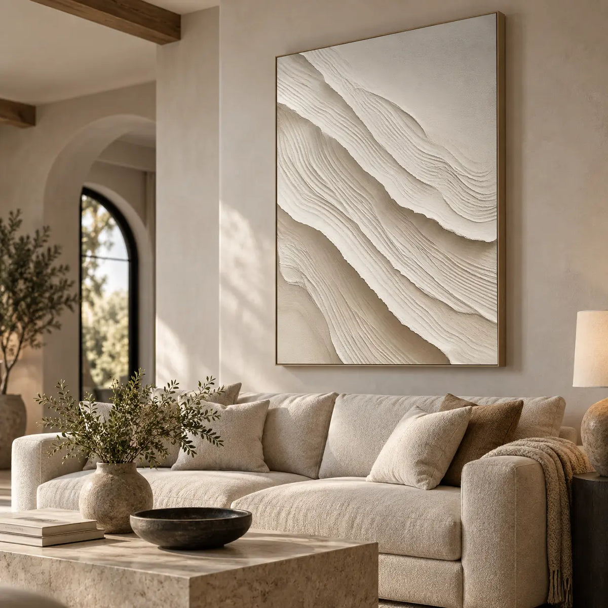Ivory Folds Descending: above a cream sofa behind a square pale stone coffee table