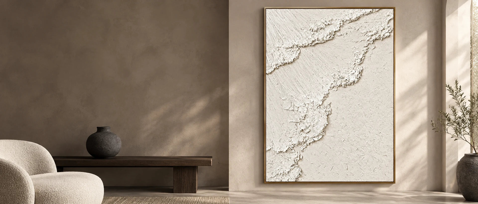 A slim gold frame defining The Ivory Ascent against a taupe wall