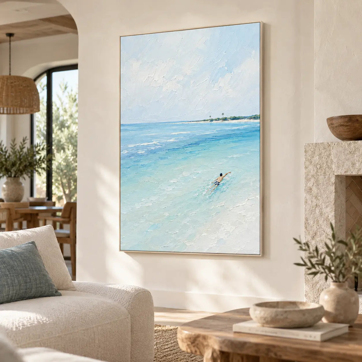 One Stroke Toward the Palms: beside a stone fireplace and cream sofa in an open living room