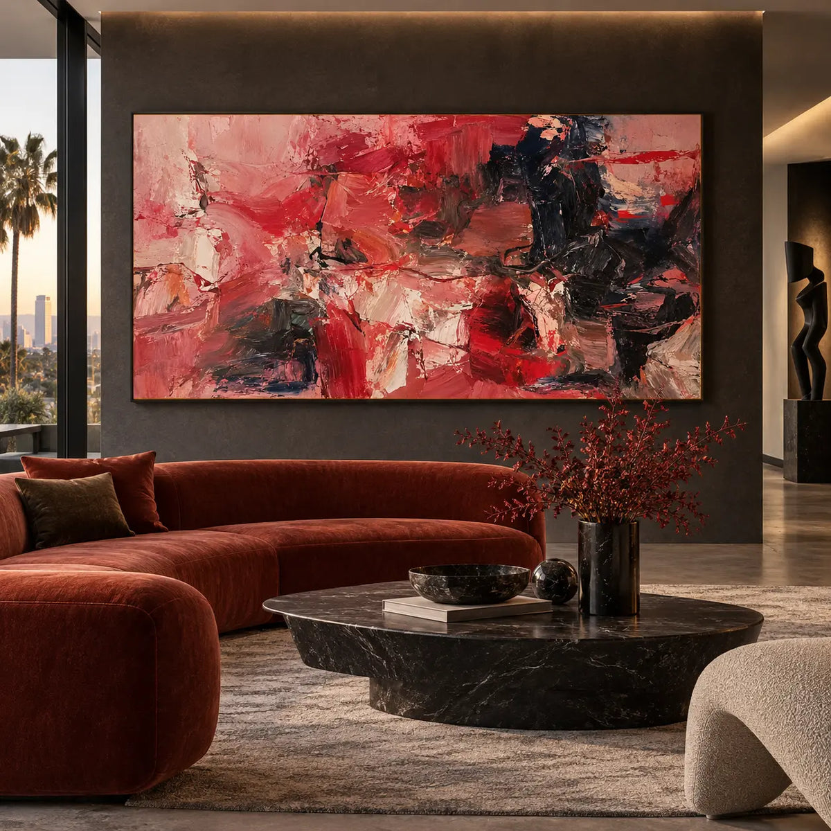 Red Fragments Around a Dark Knot: above a curved rust-red sofa with a low oval marble table