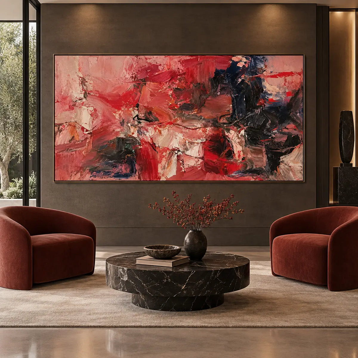Red Fragments Around a Dark Knot: between two rust-colored chairs above a round dark marble table