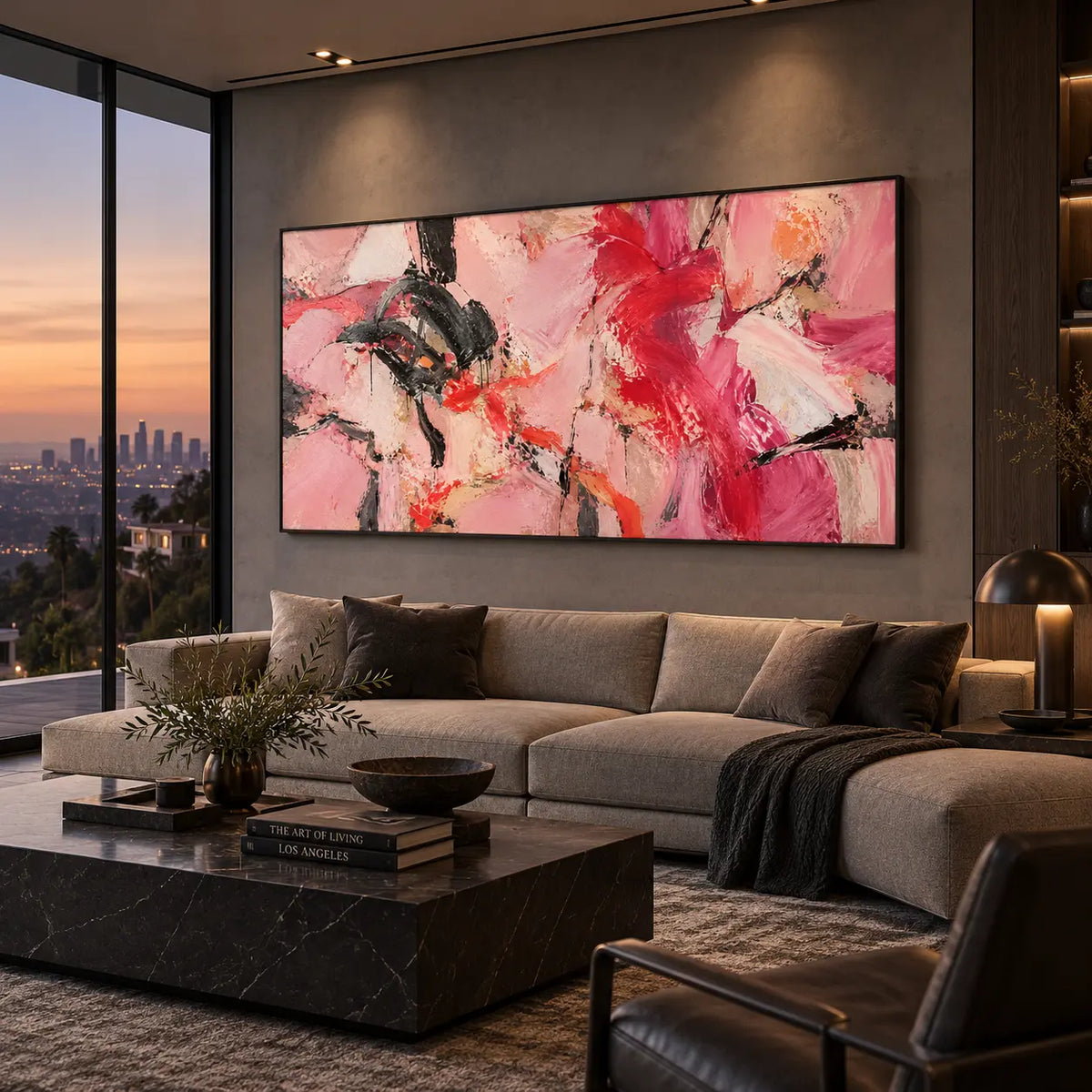 Scarlet Sweeps in Open Pink: above a taupe sectional beside dusk glazing and a brass table lamp