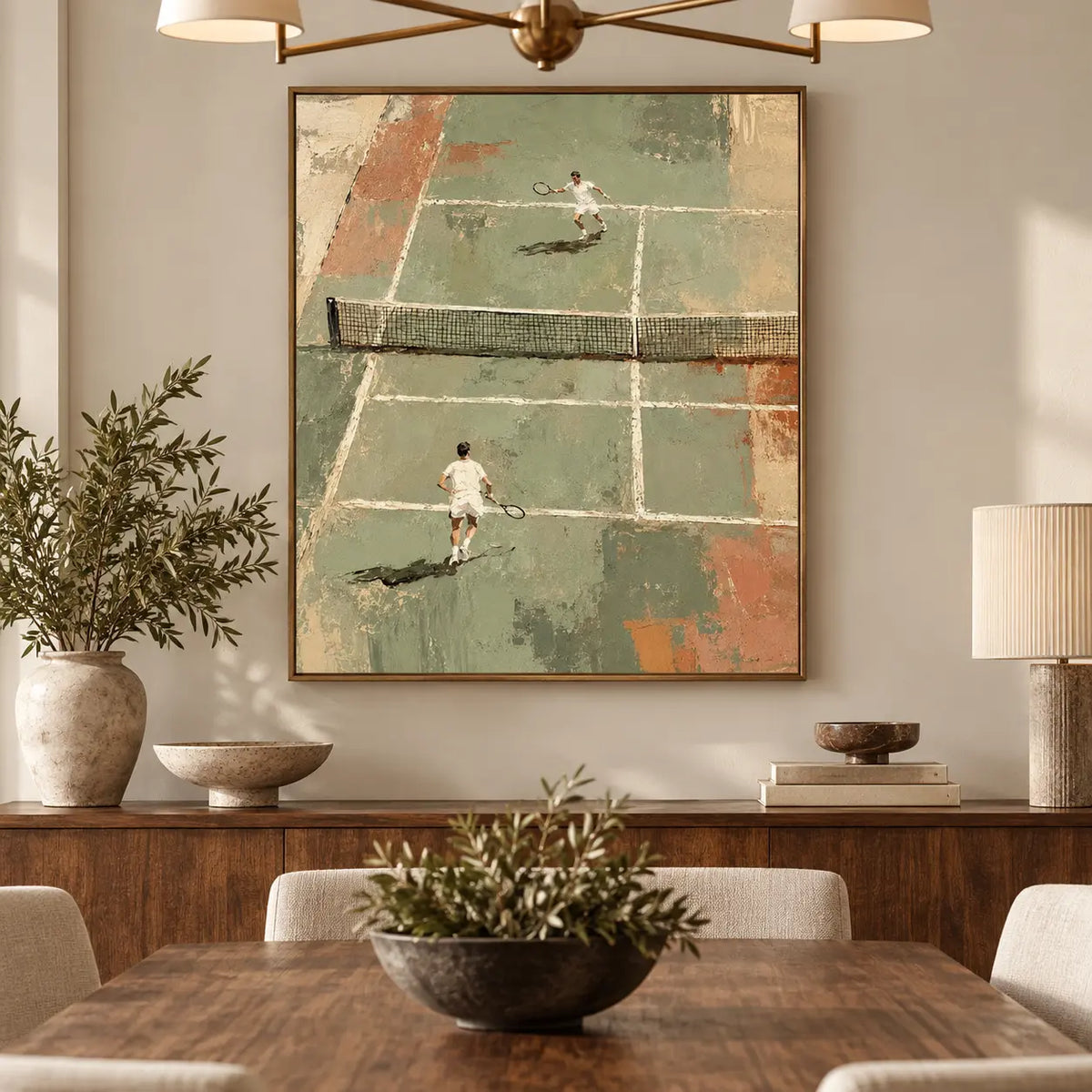 The Baseline Exchange over a dining sideboard beneath a brass fixture and beside slender candles