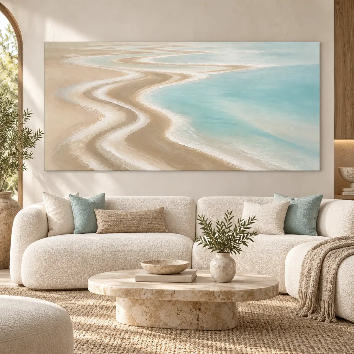 The Shore Draws a Curve: above a curved cream sofa and round pale stone table
