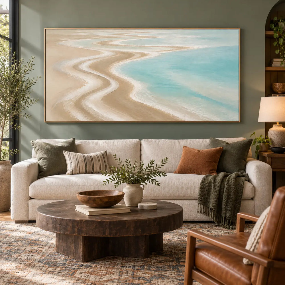 The Shore Draws a Curve: framed on an olive wall above a cream sofa with rust and green cushions