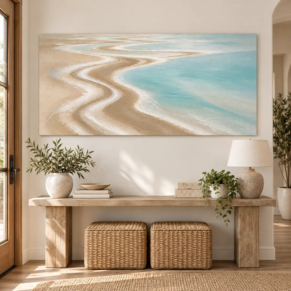 The Shore Draws a Curve: above a light wood console with two woven stools underneath