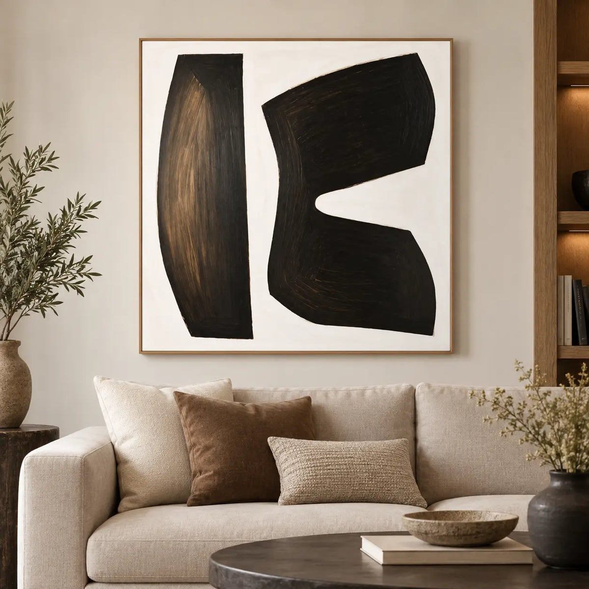 The Space Between Forms: over a cream sofa with brown and woven cushions