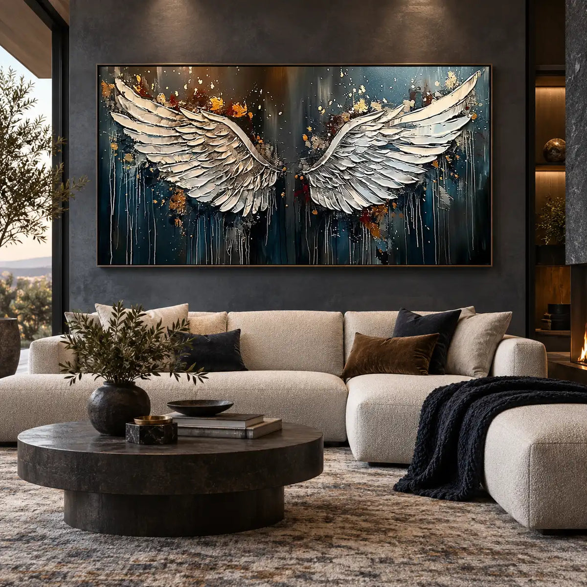 The Unfolding of Wings: above a rounded ivory sectional and dark circular table