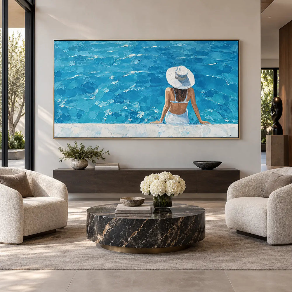 The Wide Blue Afternoon: above a low dark console between cream chairs and a round marble table