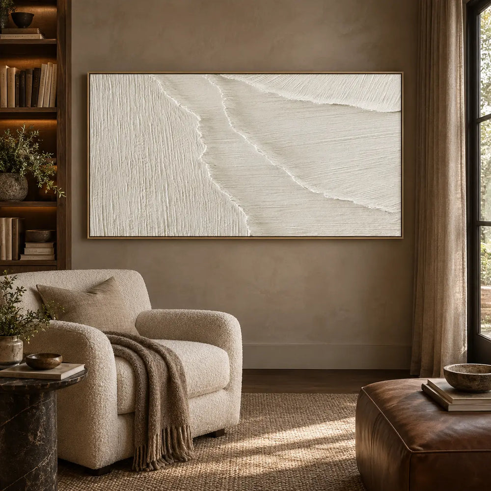 Where the Fine Lines Turn: in a reading room with a cream armchair and brown leather ottoman