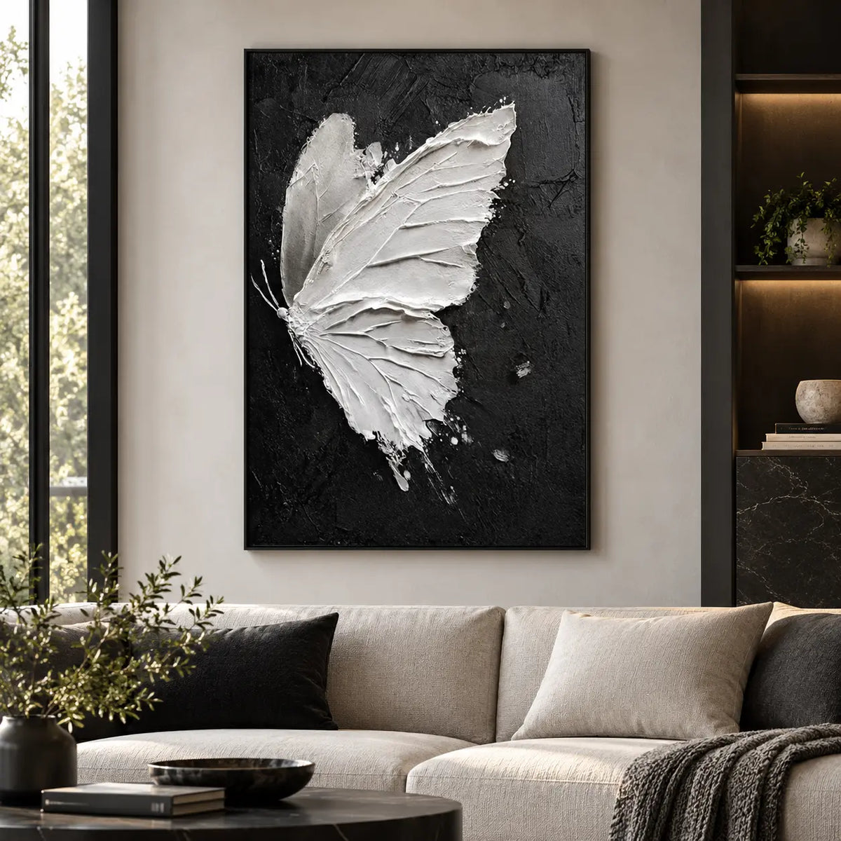 Wings Against Midnight: above an ivory sofa with dark cushions and a round black table