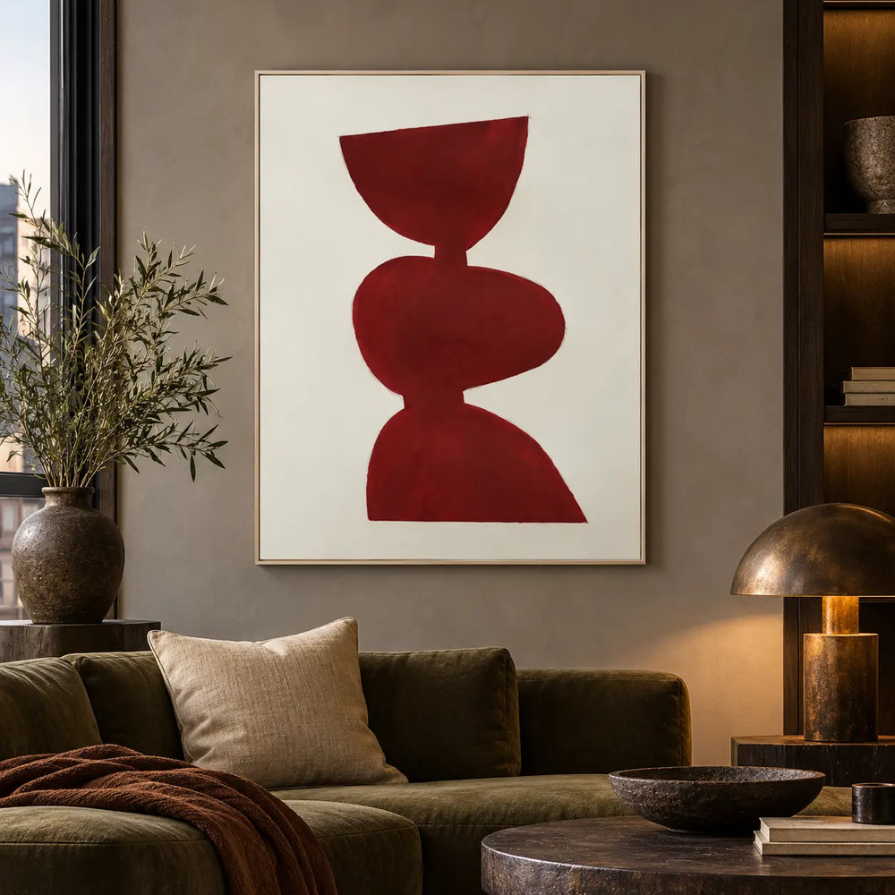 A Balance in Vermilion: above an olive sofa beside a bronze dome lamp and lit shelves
