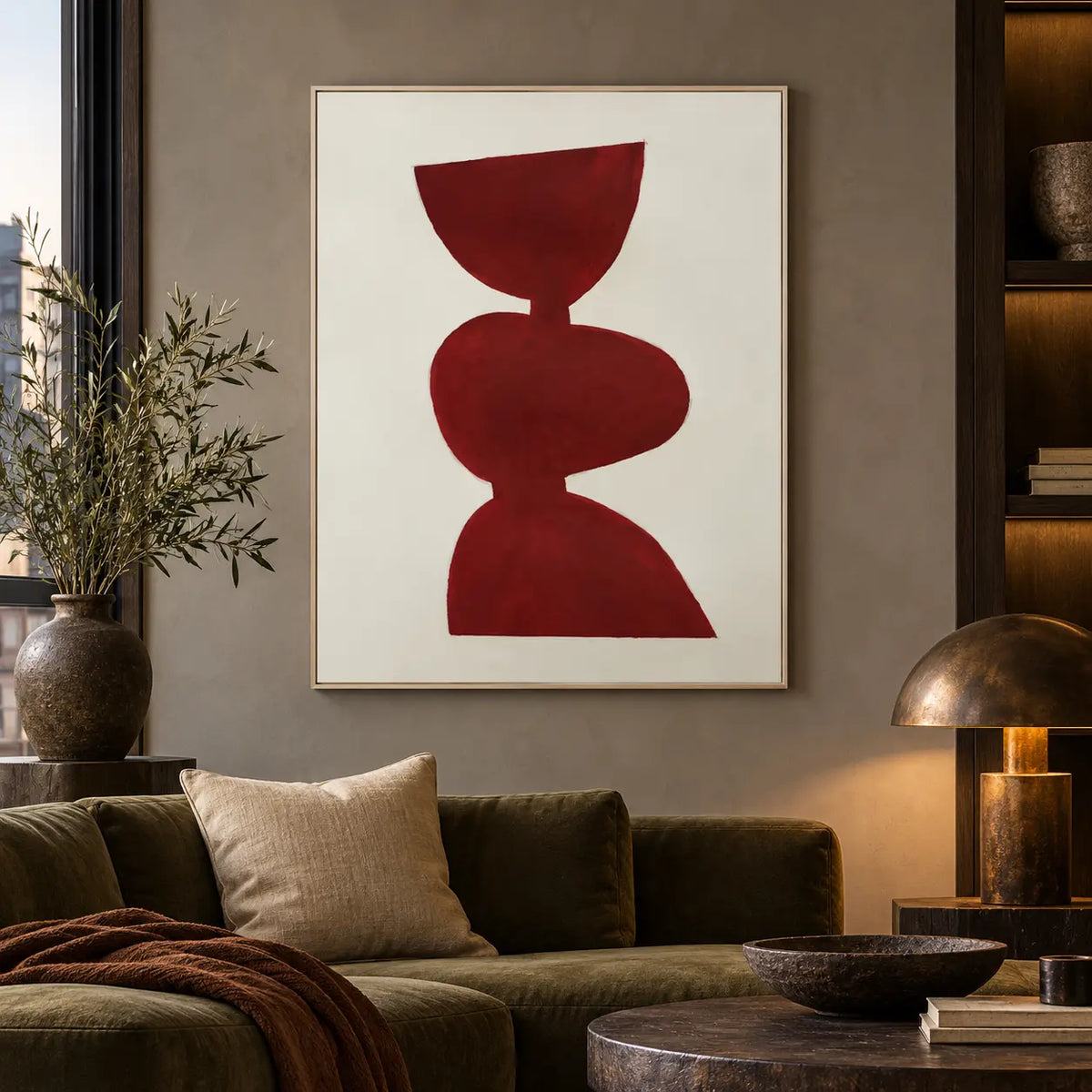 A Balance in Vermilion: above an olive sofa beside a bronze dome lamp and lit shelves