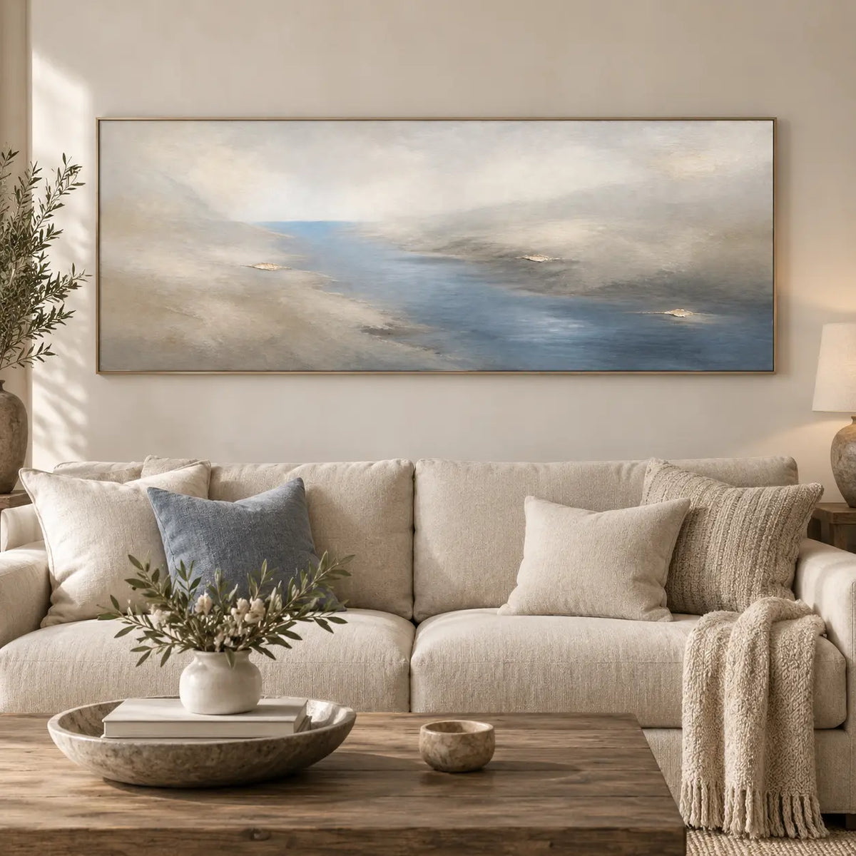 A Channel Through Pearl: framed above a cream sofa with a pale blue cushion and chunky throw