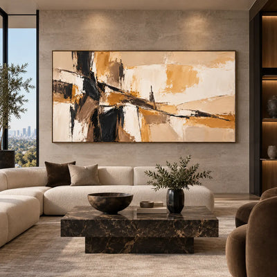 A Dark Seam Through Sand: above a cream sectional against a stone wall with a rectangular dark marble table