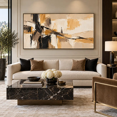 A Dark Seam Through Sand: above a cream sofa against a paneled wall with white flowers and black cushions