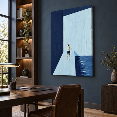 A Gesture Above the Water: beside a wood desk and leather chair against a blue office wall