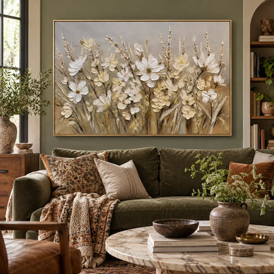 A Meadow in Linen Light: above an olive sofa with patterned textiles beside a wood bookcase