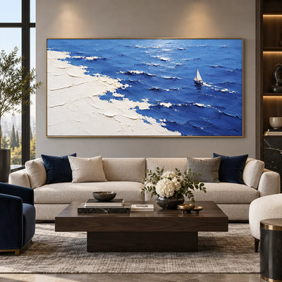 A Sail Beyond the White Margin: above a cream sofa with blue cushions and a long dark table