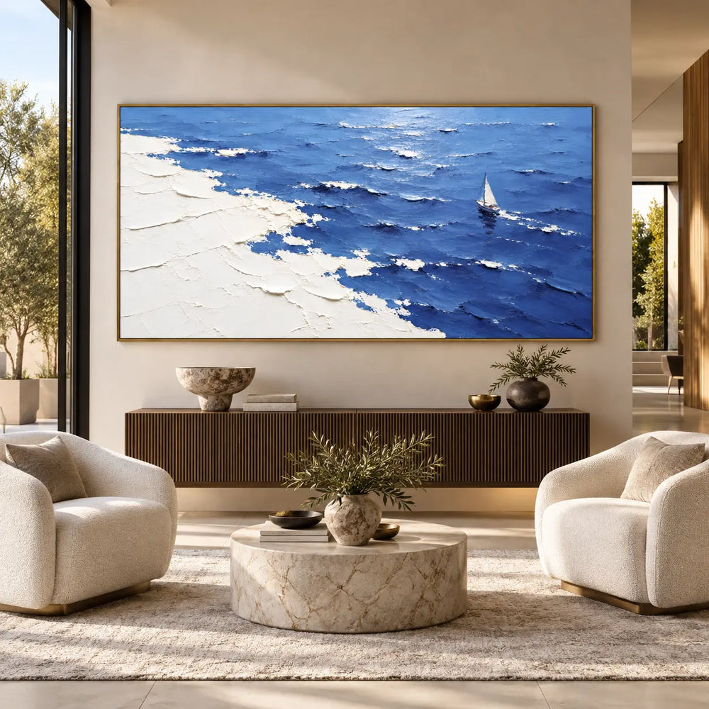 A Sail Beyond the White Margin: above a fluted console between rounded cream chairs and a pale stone table