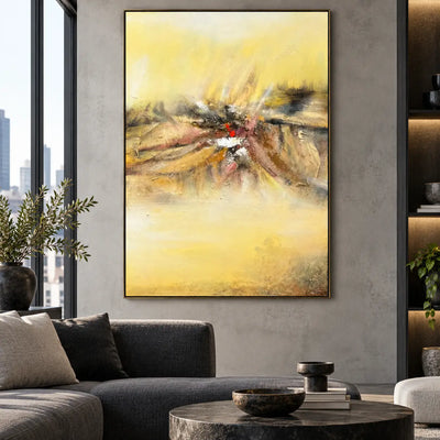 A Spark in the Haze: above a dark gray sofa beside a city-view window
