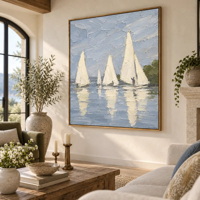 A Stillwater Gathering above a cream sectional beside an arched window and candlelit coffee table