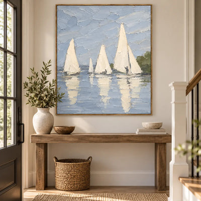 A Stillwater Gathering above an entry console beside a staircase with a basket underneath