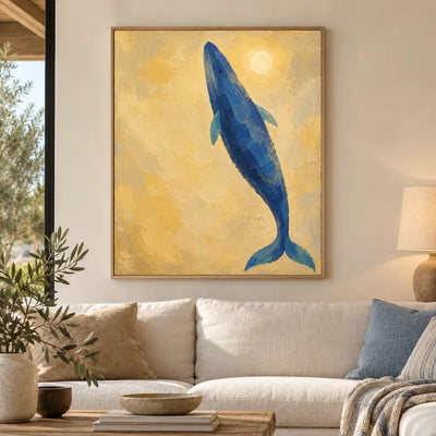 A Whale Toward the Sun: framed above a cream sofa with blue and ochre cushions