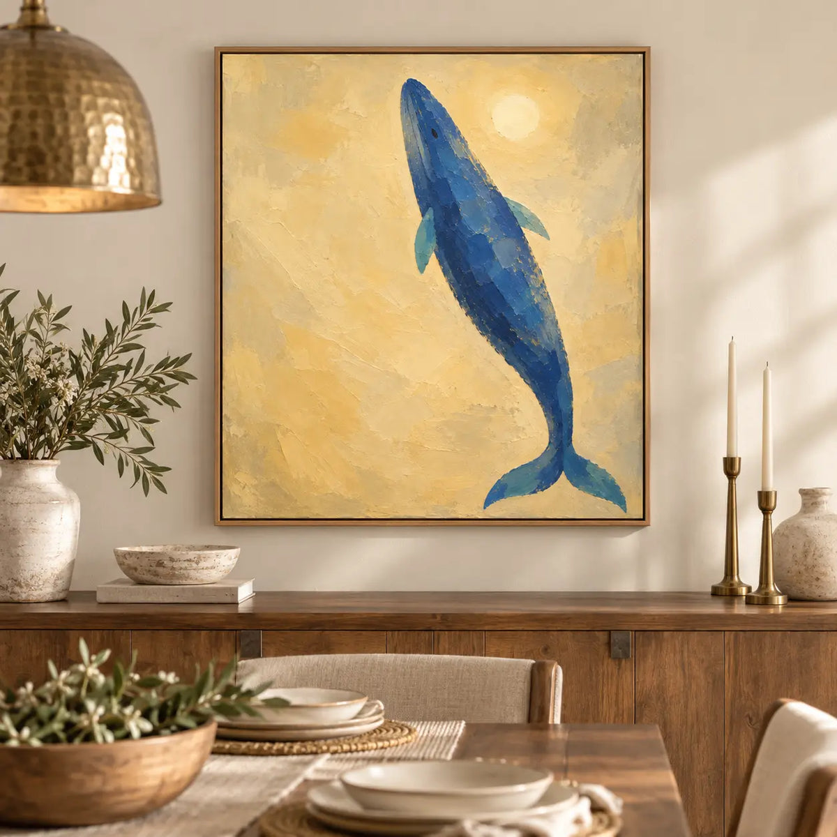 A Whale Toward the Sun: above a dining sideboard with brass candlesticks and stacked white dishes