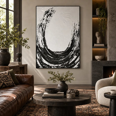 An Arc Left Open: beside a black fireplace with a brown leather sofa and dark round table