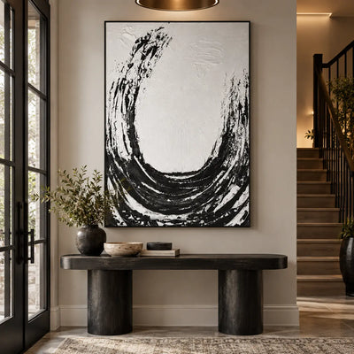 An Arc Left Open: above a black console beside a glass door and wood staircase
