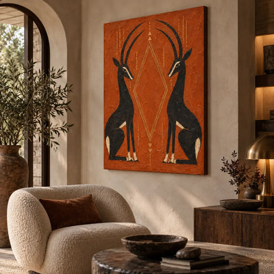 Antelopes in Balance: angled beside a cream boucle chair and brass dome lamp
