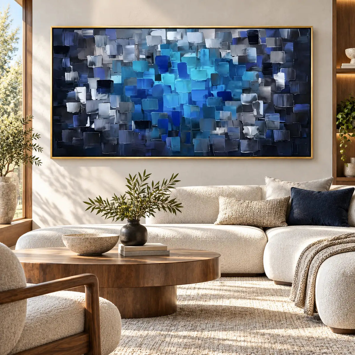 Azure at the Center: above a curved ivory sectional with a round wood table