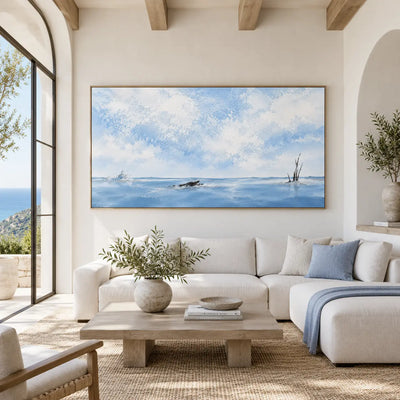 Branches in the Winter Expanse: beneath ceiling beams above light seating and a stone coffee table