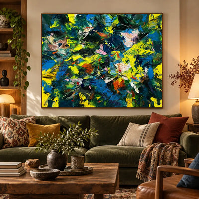 Cobalt and Citron Collision: above an olive sofa with colorful cushions and wooden shelves