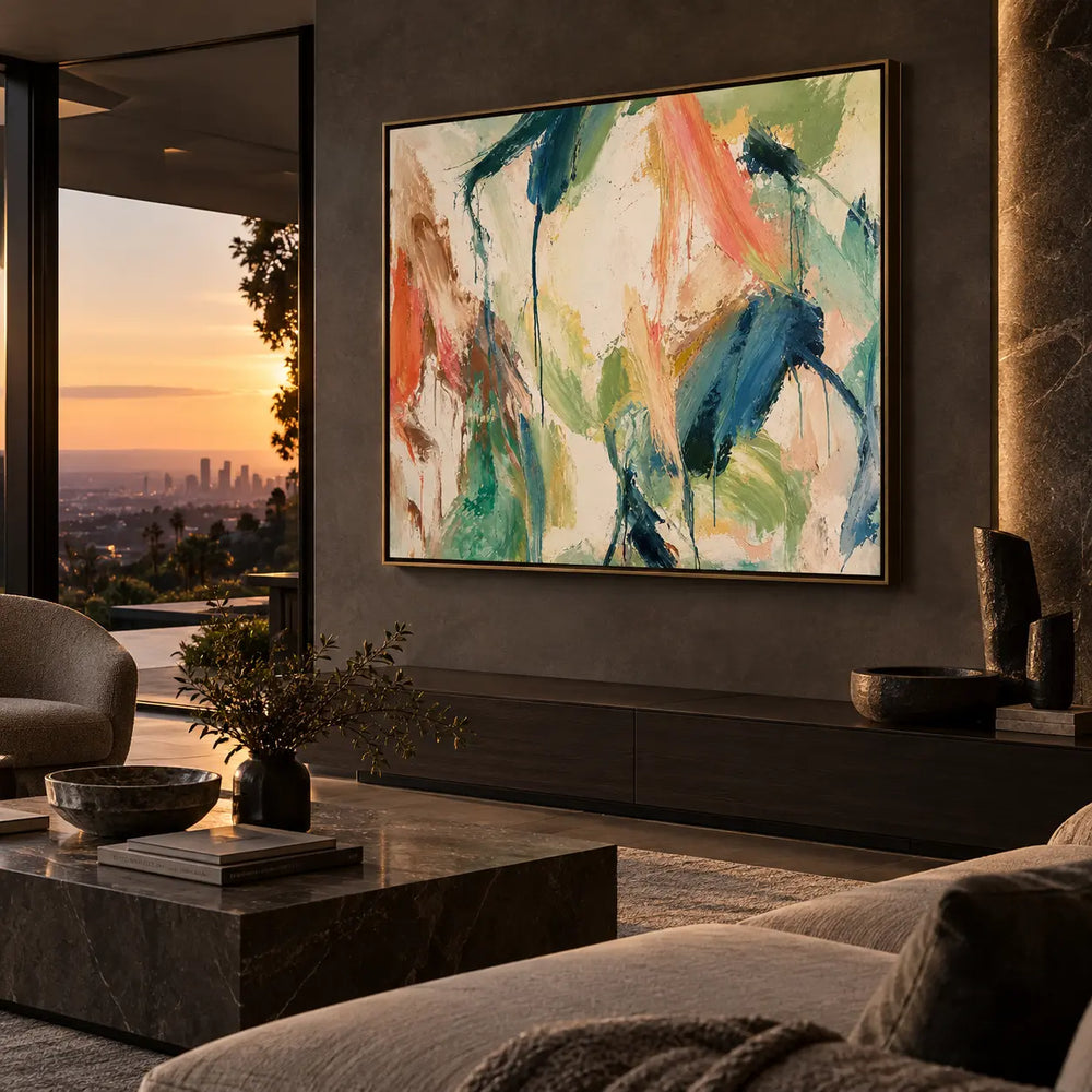Coral Ribbon Beside Falling Blue: above a long cabinet beside a sunset view and pale seating