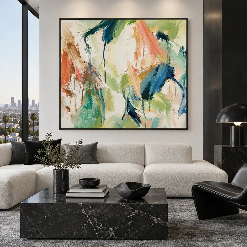 Coral Ribbon Beside Falling Blue: above a white sofa with dark cushions beside a black fireplace
