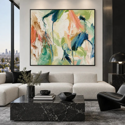Coral Ribbon Beside Falling Blue: above a white sofa with dark cushions beside a black fireplace