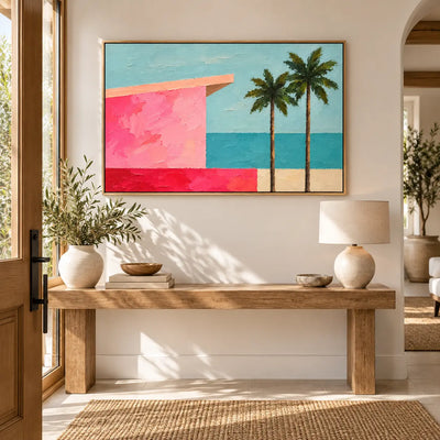 Coral Shore Pavilion above an entry console with pale ceramic vessels and strong window shadows