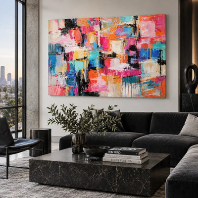Coral Steps Through Turquoise: above a black sofa behind a marble table and leafy arrangement