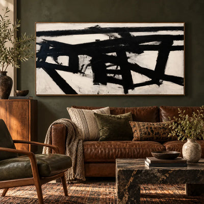 Crossing the Ivory Field: above a brown leather sofa against an olive wall